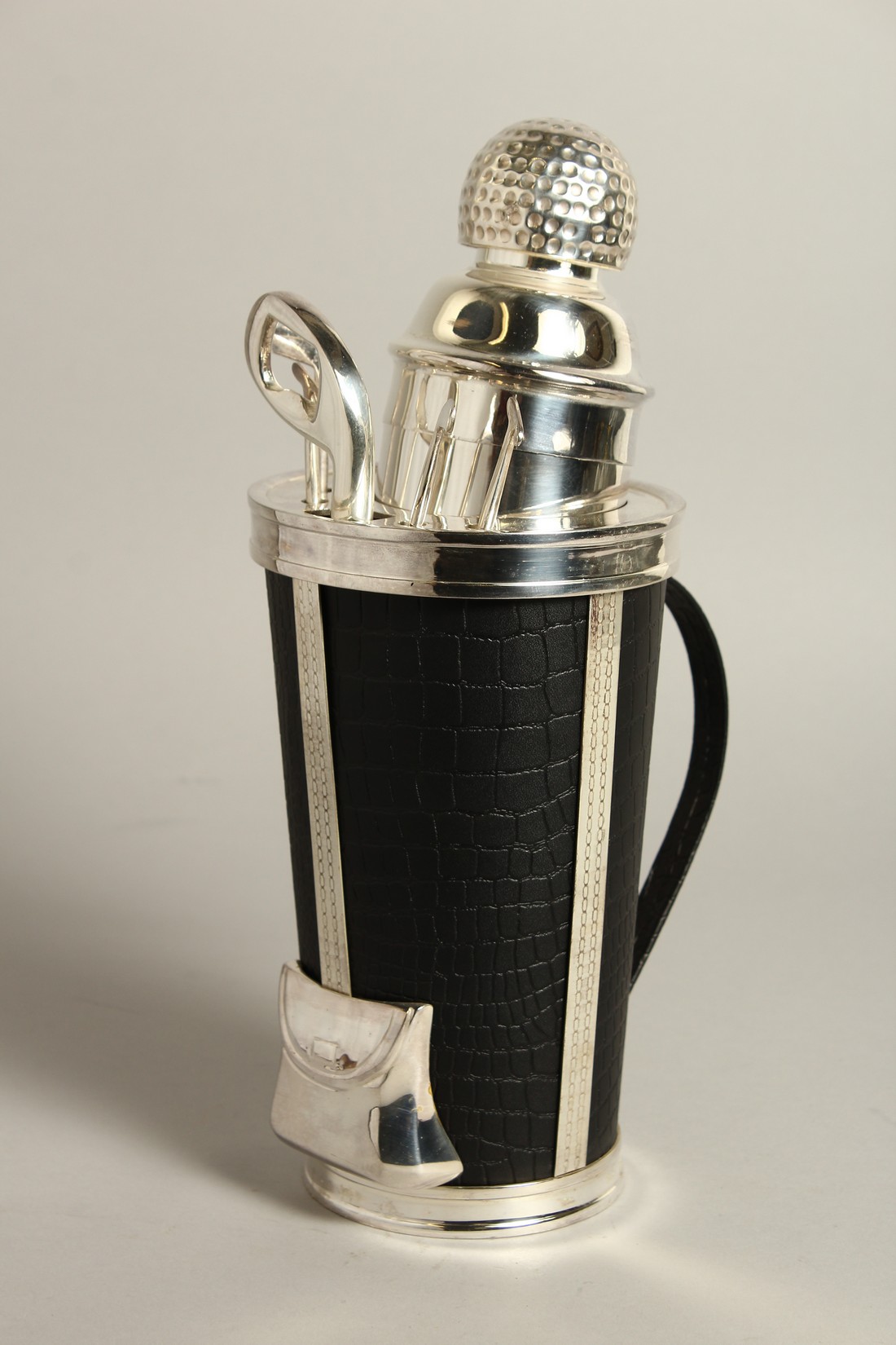 A SILVER PLATED GOLF BAG COCKTAIL SHAKER