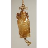 A CARVED JADE GOLD PENDANT. 2.25ins long.