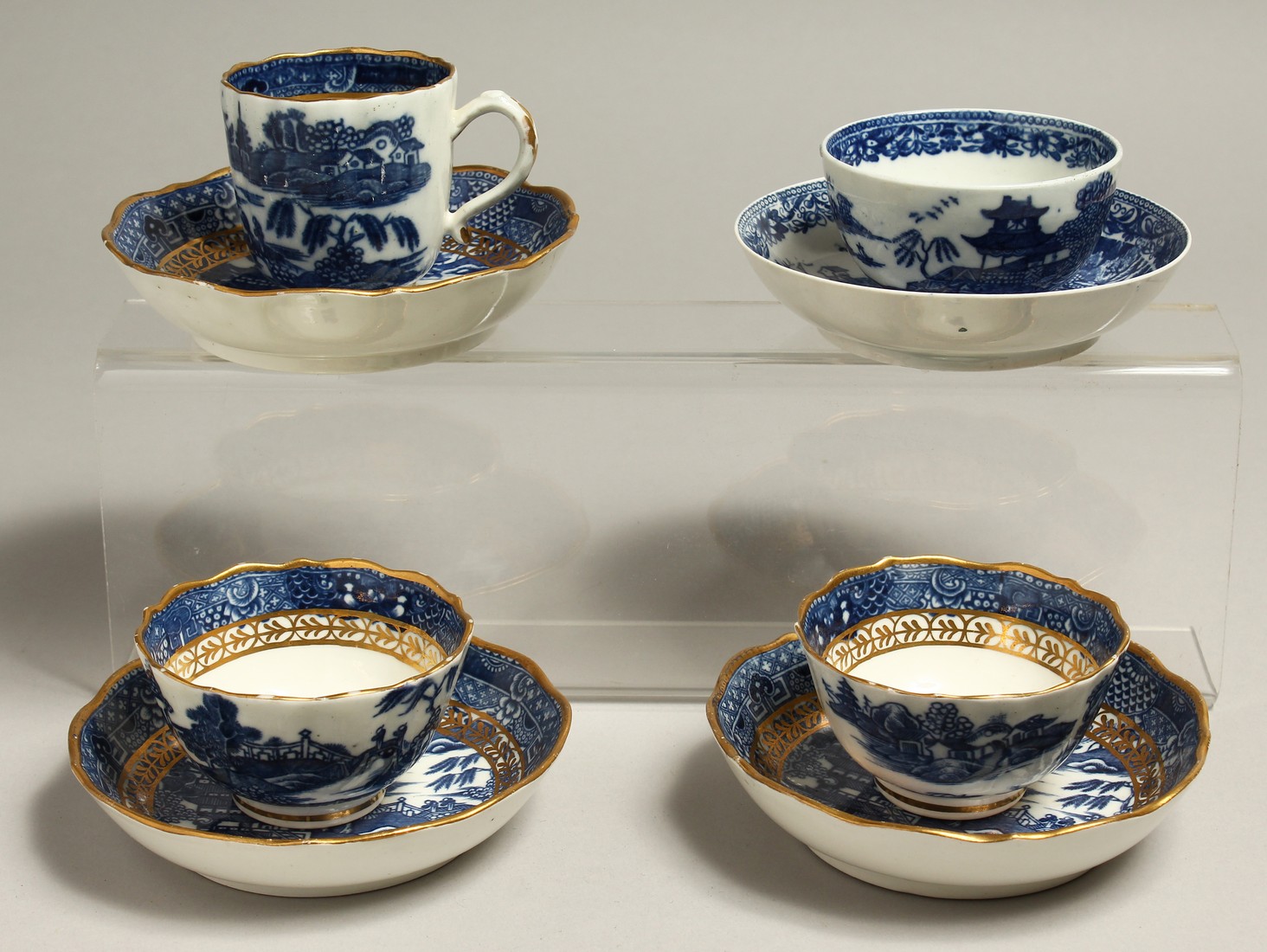 AN 18TH CENTRUY CAUGHLEY TEA BOWL AND SAUCER with the uncommon Fenced Garden pattern, together