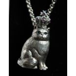 A SILVER CAT WITH CROWN PENDANT AND CHAIN.