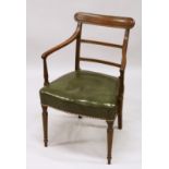 A GOOD GEORGE III MAHOGANY ARM CHAIR with leather seat and turned legs.
