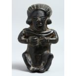 A SOUTH AMERICAN POTTERY SEATED ANTIQUITY 6ins.