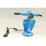 A BLUE VESPA LAMP.