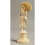 A GOOD EUROPEAN IVORY CARVING OF A YOUNG LADY with a parasol, on a plinth. 6ins high.