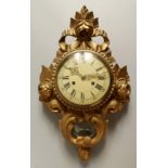 A FRENCH GILTWOOD CARTEL WALL CLOCK, the case with roses. 19ins high.