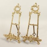 A PAIR OF BRASS PICTURE EASELS. 14ins long.