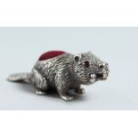 A CAST SILVER BEAVER PIN CUSHION.