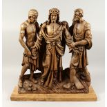 A SUPERB 18TH CENTURY GERMAN, CARVED LIMEWOOD GROUP, CHRIST with two men, the base with a cross