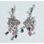 A PAIR OF SILVER MARCASITE, RUBY AND EMERALD ANGEL FISH EAR RINGS.