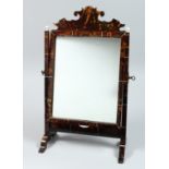 A GOOD TORTOISESHELL MIRROR on a stand 18ins