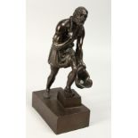 A GRAND TOUR BRONZE "Beggar holding a hat" on a rectangular base. 9ins high.