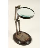 A LARGE MAGNIFYING GLASS on a stand