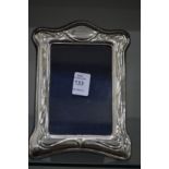 An Art Nouveau silver photograph frame.