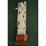 An eastern carved ivory deity.