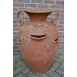 A large terracotta twin handled urn, 3ft high.