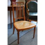 A satinwood occasional chair.