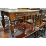 A Victorian mahogany two drawer library table with inset leather top.