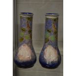 A pair of Royal Doulton tubeline decorated vases.