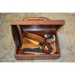 A shoe shine box and contents.