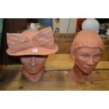 Two terracotta busts.