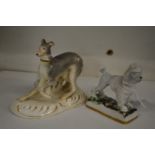 A Staffordshire model of a greyhound and a poodle.