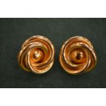 A pair of Lisa Jones swirl earrings.