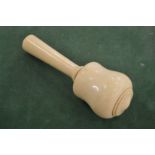 An ivory mallet.