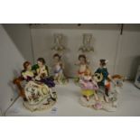 Decorative porcelain figure groups and candlesticks.