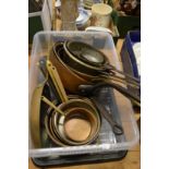 A quantity of copper and other cooking pans.