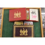 Two boxed sets of playing cards.