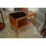 A Swedish teak two tier drop flap tea trolley.