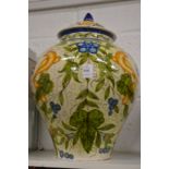 A good large Cantagalli vase and cover painted with birds amongst foliage.