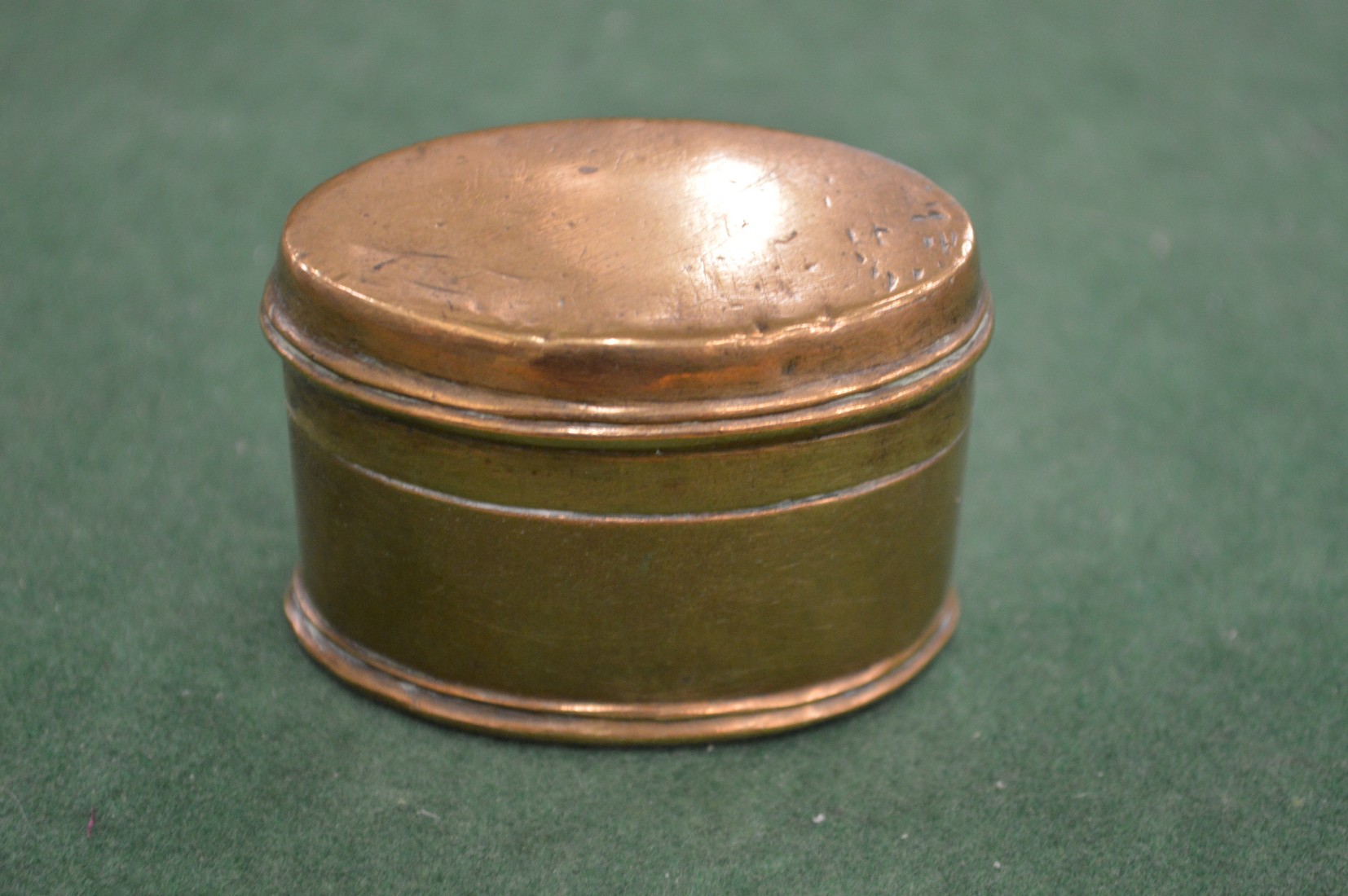 A brass snuff box.