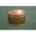 A brass snuff box.