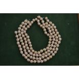 Various strands of pearl beads.