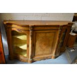 A Victorian walnut credenza with ormolu mounts.