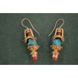 A pair of gilt metal and turquoise chandelier style earrings.