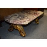 A marble top coffee table with giltwood base.