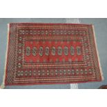 A small Bokhara rug.