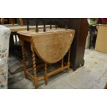 An oak drop leaf table.