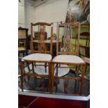 A pair of inlaid mahogany occasional chairs.