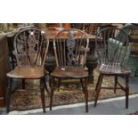 Three 19th century Windsor single dining chairs, two with pierced and carved back splats.