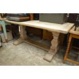 A large oak refectory style table.