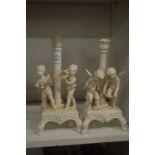 A pair of white porcelain figural candlesticks.