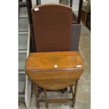 An oak drop leaf gate leg table and a folding screen.