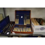 A cased carving set and other items.