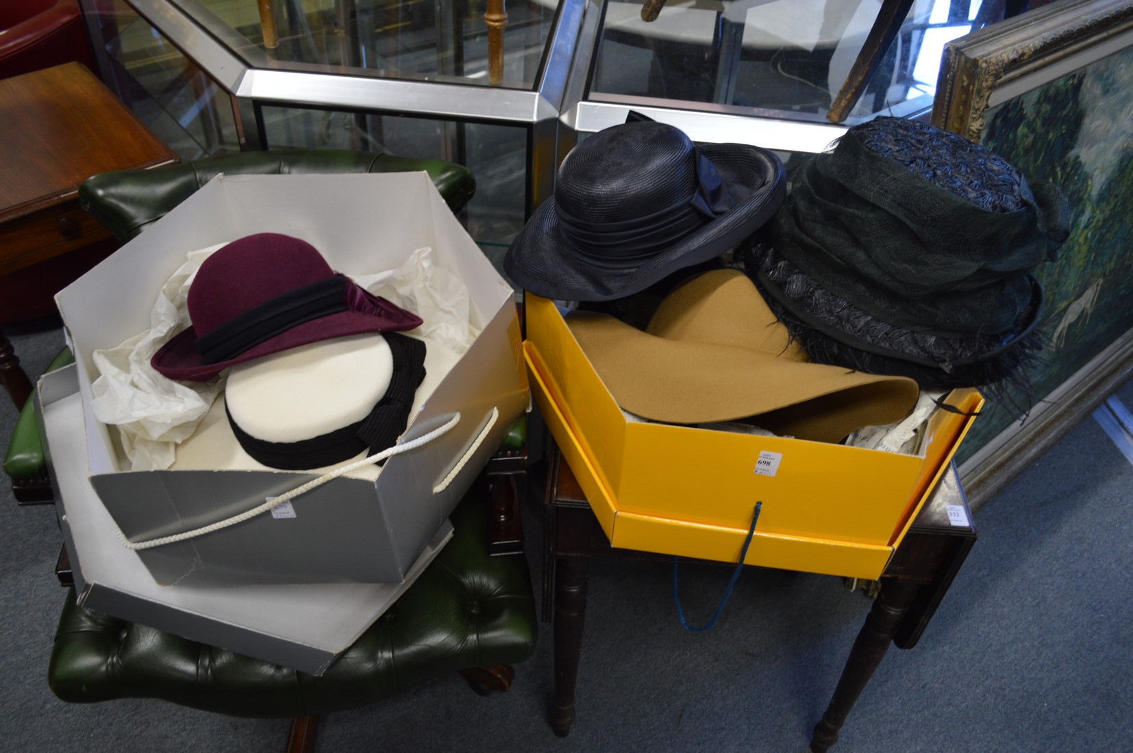 Two boxes containing ladies' hats.