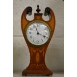 An Edwardian inlaid mahogany mantle clock.