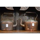 Two old copper kettles.
