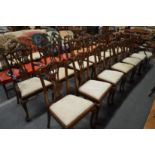 A set of twelve Chippendale style mahogany dining chairs, two with arms.